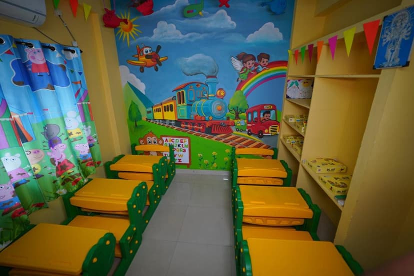 Colourful themed classroom with train mural and learning materials at Golden Bridge School